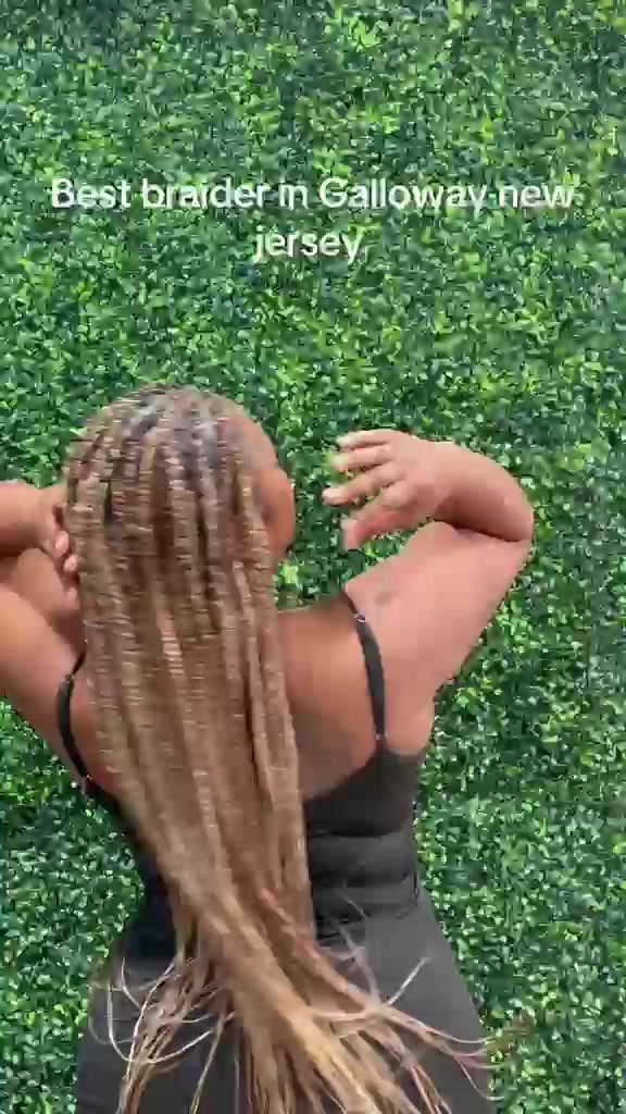 Blonde knotless braids styled by Joy